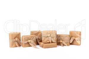 Gift box for Christmas wrapped in brown recycled paper