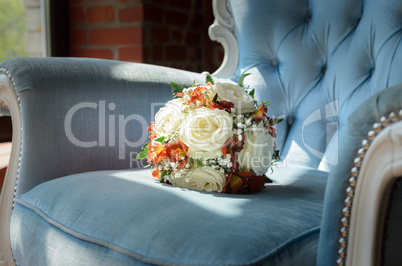 Bridal bouquet in soft antique chair