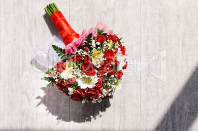 brides bouquet on a vintage wooden floor