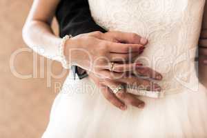 the bride and groom held hands