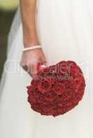 the bride's bouquet of red roses