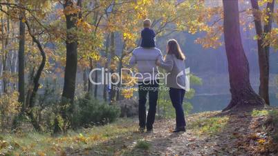 family walking in beautiful park