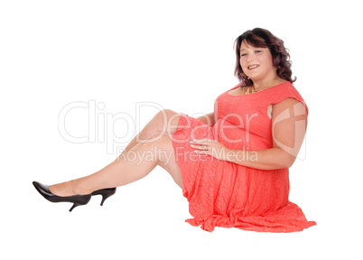 Overweight woman sitting on floor