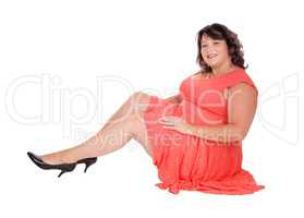 Overweight woman sitting on floor