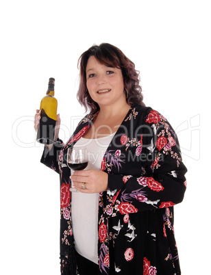 Big woman standing with a bottle wine
