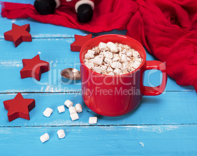 hot chocolate with marshmallows in a red ceramic mug