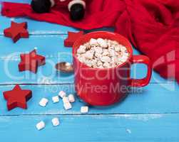 hot chocolate with marshmallows in a red ceramic mug