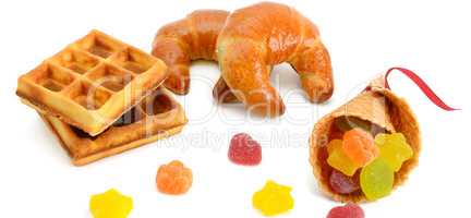 Croissants, waffles and marmalade isolated on white background