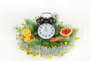 Christmas or New Year ornament. clock, spruce branches, spices,