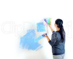 girl picks up the color of paint for painting