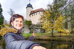Woman points to the castle Rabenstein of Chemnitz