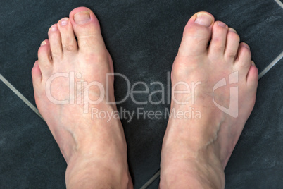 Naked feet of a man 60+