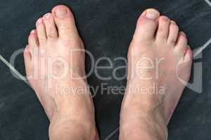 Naked feet of a man 60+