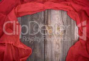 abstract gray wood background and red scarf