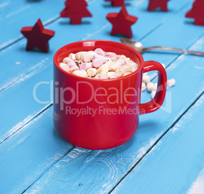 hot chocolate with marshmallow in a red ceramic mug