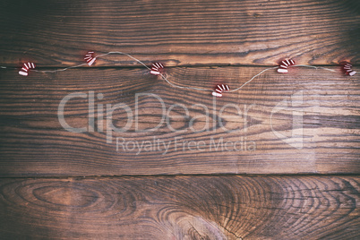 brown wood background and festive garland