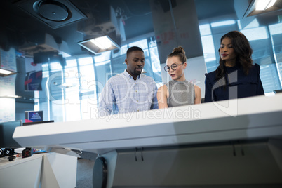 Business executives touching digital screen