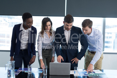 Executives working together at desk