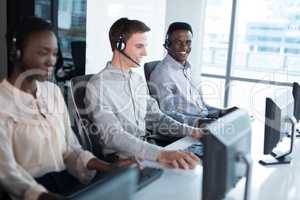 Customer service executives working at office