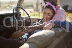 Couple relaxing together in car