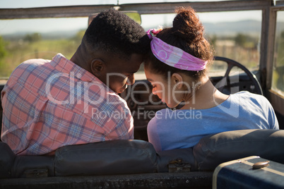 Couple romancing in a car