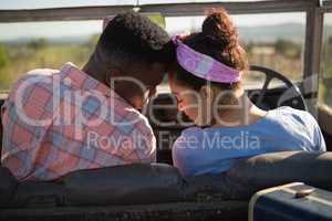 Couple romancing in a car