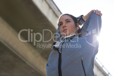 Fit woman doing stretching exercise