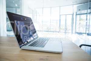 Laptop on wooden desk