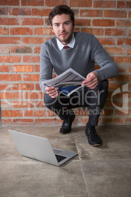 Executive holding a document in the office