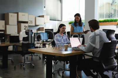 Executive working on laptop at desk