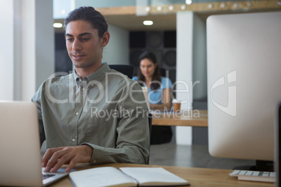 Executive working on laptop at desk