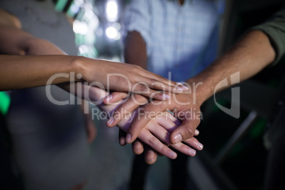 Close-up of business executives forming hand stack