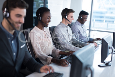 Customer service executives working at office