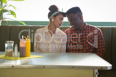 Couple romancing in restaurant