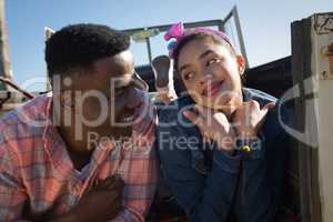 Couple interacting with each other in car