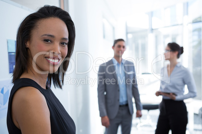 Beautiful female executive looking at camera