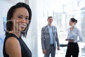 Beautiful female executive looking at camera