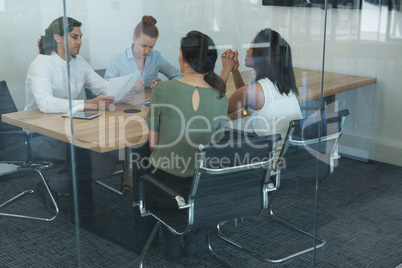 Group of executives discussing while working at the desk