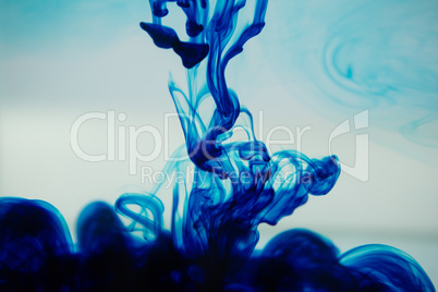 Blue ink spreading in the water