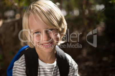 Portrait of beautiful little girl in the forest