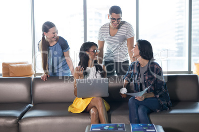 Smiling executives working together in office