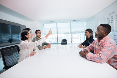 Business executives interacting in boardroom