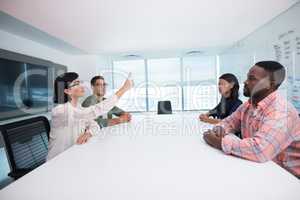Business executives interacting in boardroom