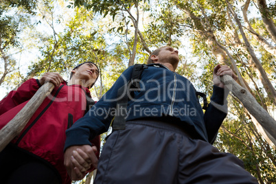 Hiker couple walking in forest