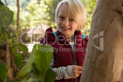 Smiling girl in the forest