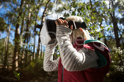 Little girl using virtual reality headset