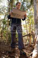 Hiker reading a map on a sunny day