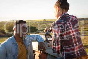 Couple interacting with each other at countryside