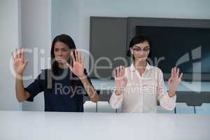 Business executives gesturing in boardroom
