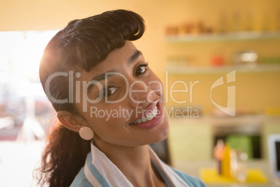 Waitress smiling in restaurant